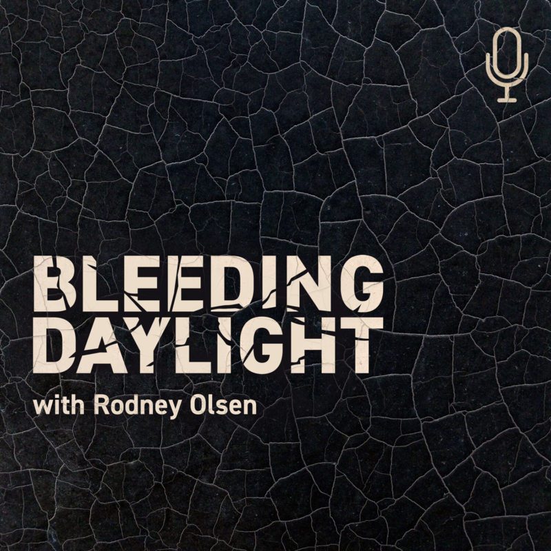 Bleeding Daylight with Rodney Olson Cover Art (Black cracking background, light pink words)