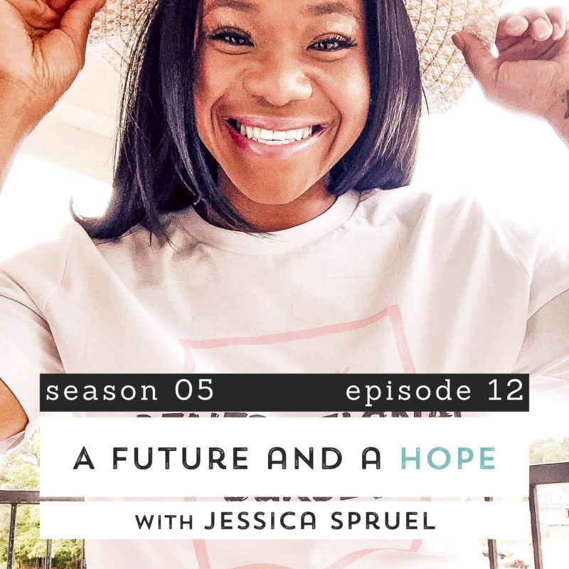 Jessica Spruill smiling in a wide-brimmed hat in the sun